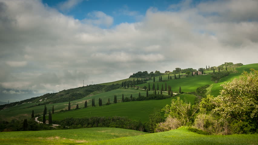 The famous winding road with cypresses from la Foce to Castelluccio, near Siena. Landscape in Val d'Orcia. Tuscany, Italy.