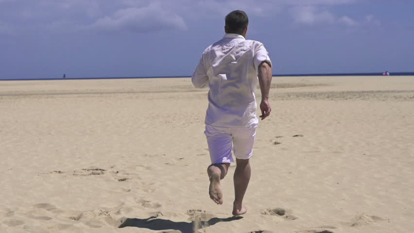 Man running on beautiful beach
