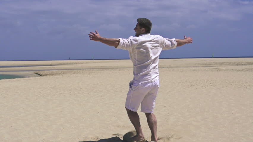 Young happy man on the beach, super slow motion, shot at 240fps
