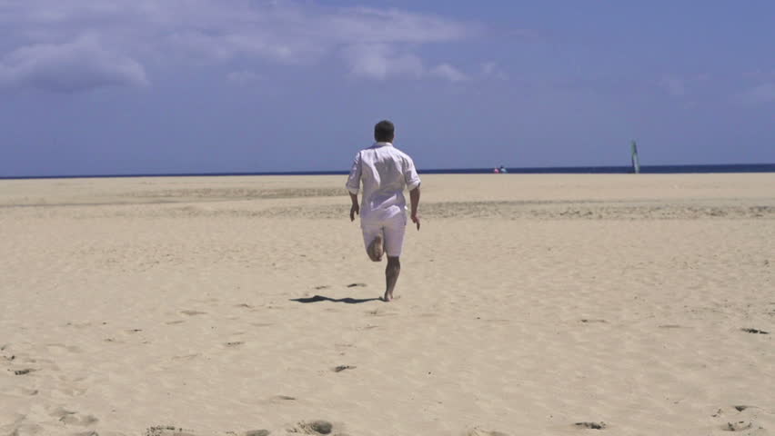 Man running on beautiful beach, super slow motion, shot at 240fps
