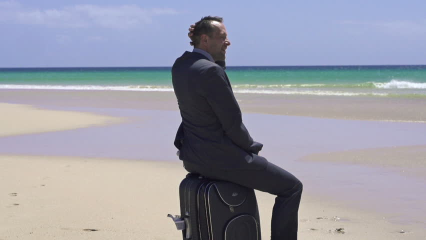 Businessman relaxing on the beach, super slow motion, shot at 240fps
