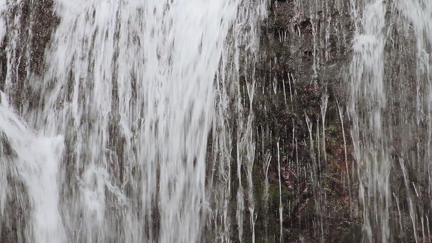 Water curtain, detail of a forest waterfall 