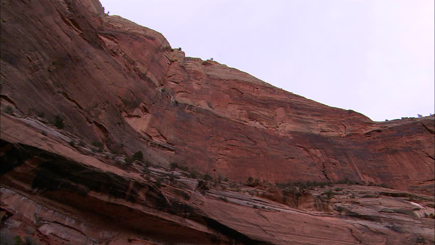 Pan across mountain surface from low angle