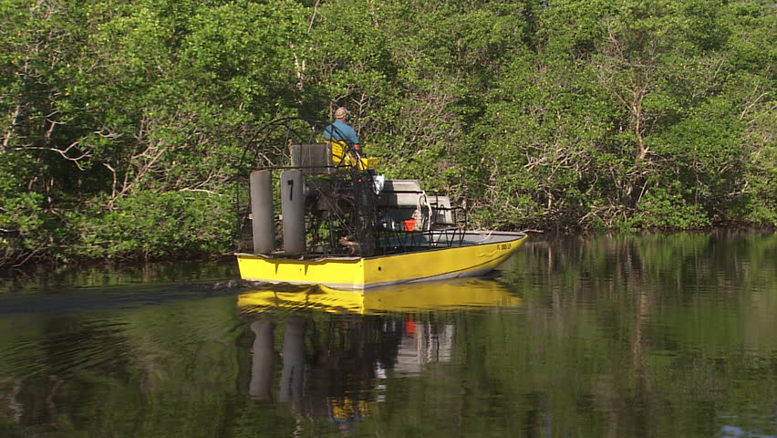 Track along an air boat slowly moving through the water