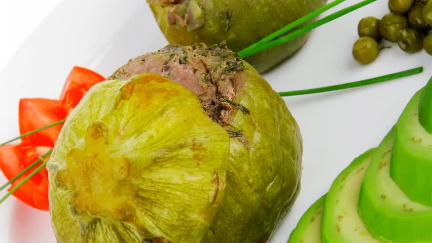 meat meal: round zucchini filled mince meat dish served with vegetables 1920x1080 intro motion slow hidef hd