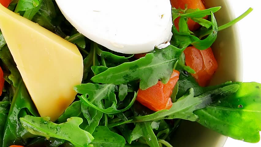 green salad with salmon and tomatoes in green bowl 1920x1080 intro motion slow hidef hd