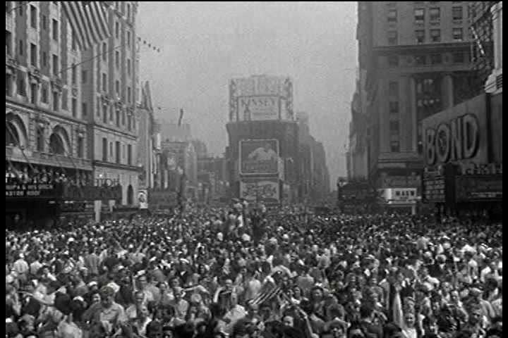 1940s - People celebrate on the streets of New York City following Japan's surrender in World War Two.