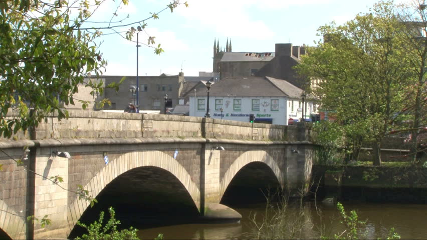 COLERAINE, NORTHERN IRELAND : AUGUST 2012: Two stone bridge arches with the River Bann flowing through them.