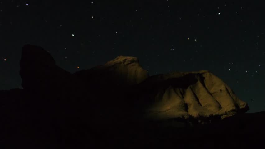 Astrophotography Time Lapse Moonshadow across Sandstone Zoom In