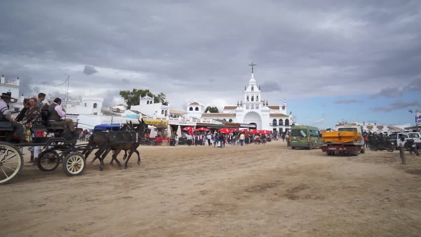 El ROCIO, ANDALUCIA, SPAIN - MAY 19: Pilgrims, people attend to the Sanctuario de Nuestra Senora de El Rocio in one of the most famous religious pilgrimage of Spain. May 19, 2013 in el Rocio, Spain