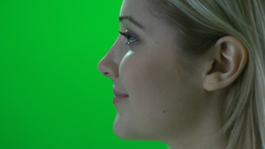 women face profile close up isolated against green screen