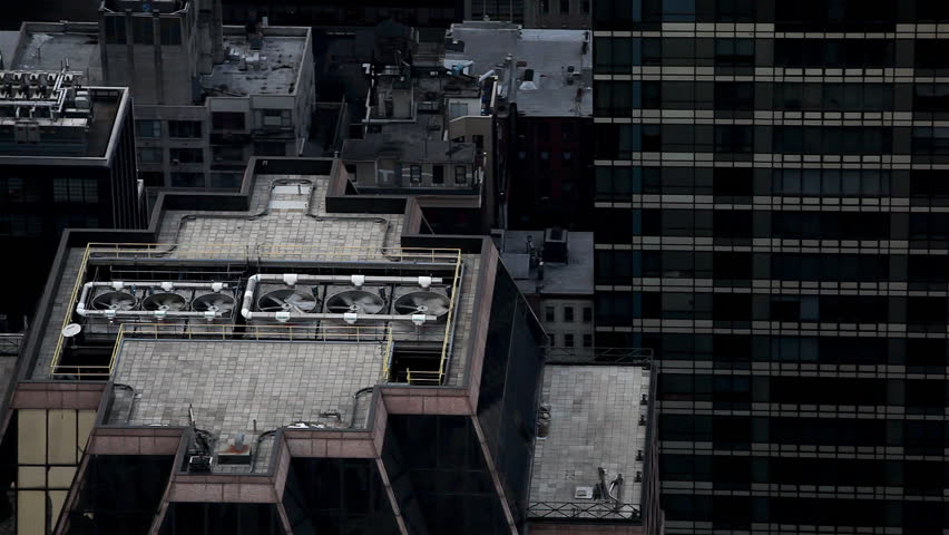 Top of a skyscraper with air condition fans spinning / HD1080 / 29.97fps