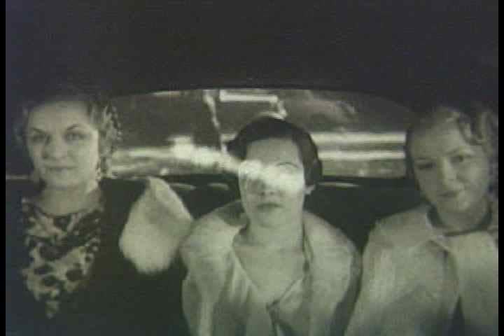 1930s - Chevrolet Leader News excerpt 1935. Women showing off their hairstyles in an automobile moving along New York City streets.