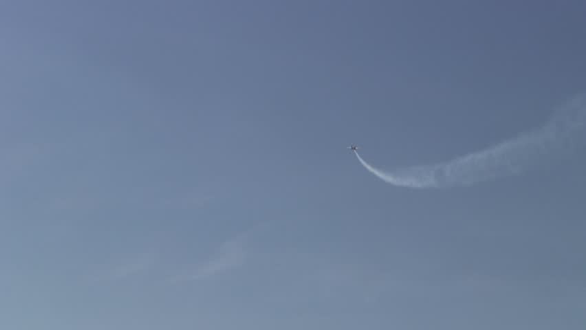 Fighter air jet performing aerobatics stunt