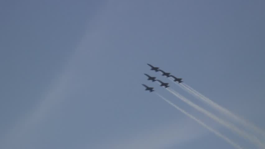 Fighter air jet performing aerobatics stunt