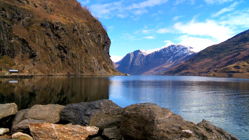Mountains & crystal clear water of a glacial nordic fjord