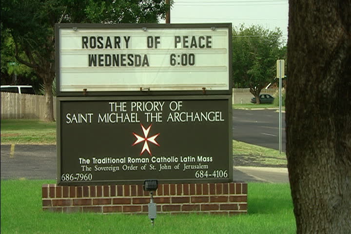 MIDLAND, TEXAS - OCTOBER 30, 2003: Sign in front of church. Marquee announces Rosary of Peace