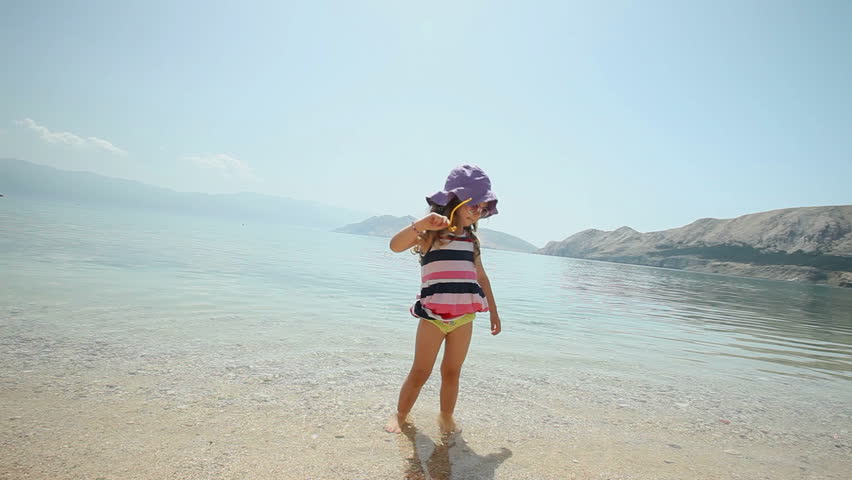 Child playing in the water on beach