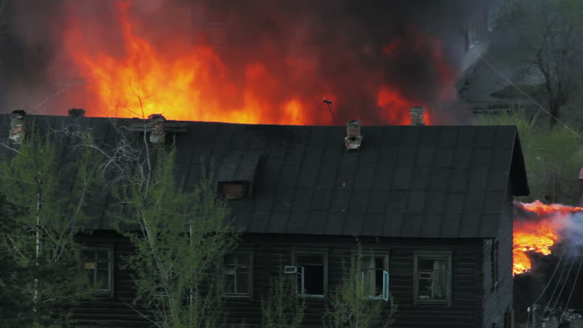 Wooden residential house in fire. Russia