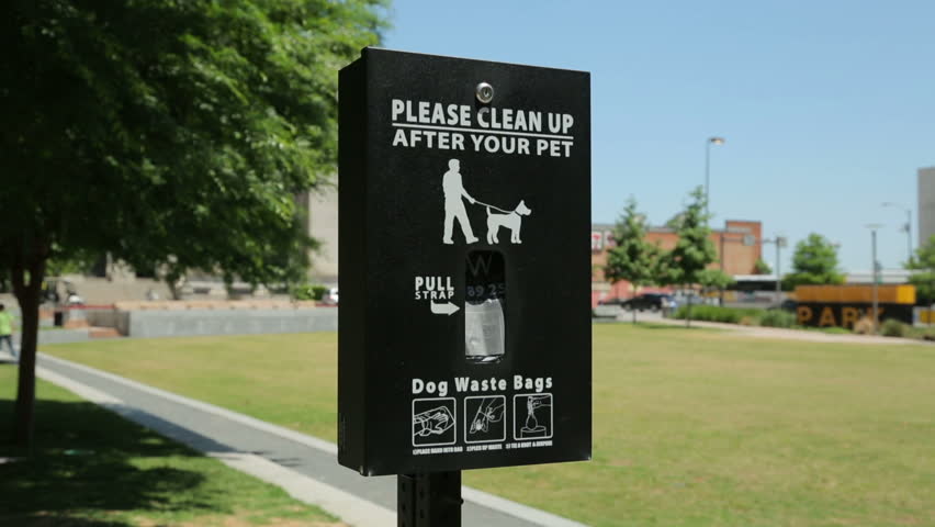 Dog waste bags container, Main Street Garden Park, Dallas, Texas, USA