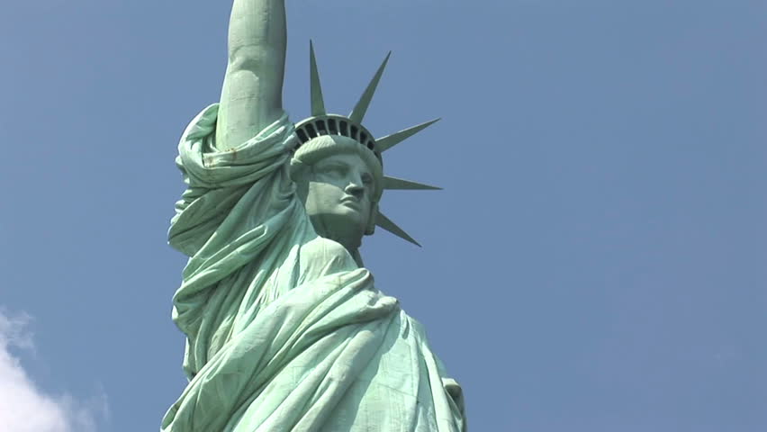 New York - MAY 16 2009: Tourists are starting to return to popular vacation spots like the Statue of Liberty after the world wide recession starts showing signs of recovery. 