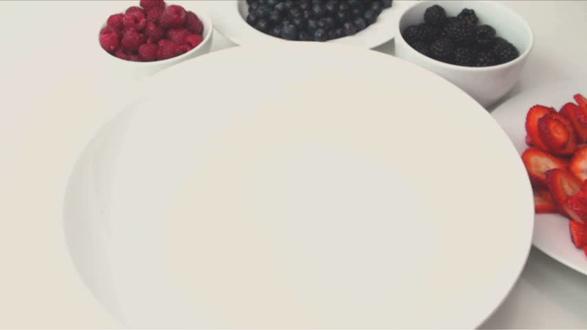 1920x1080 Chef tosses strawberries, blackberries, blueberries and raspberries into bowl, sprinkles sugar, tosses into delectable desert.