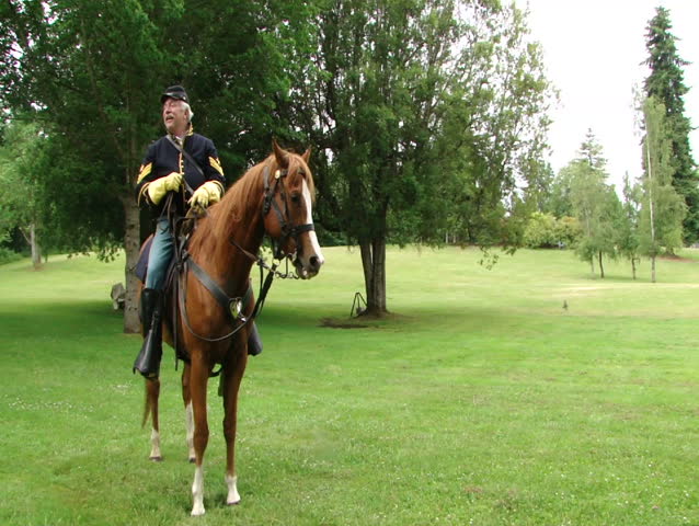 PORT GAMBLE, WA - JUN 20: A Civil War reenactor participates in a mock battle as a Union cavalry sergeant on June 20, 2009 in Port Gamble, WA. 