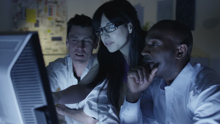 Creative business team working late at night. 