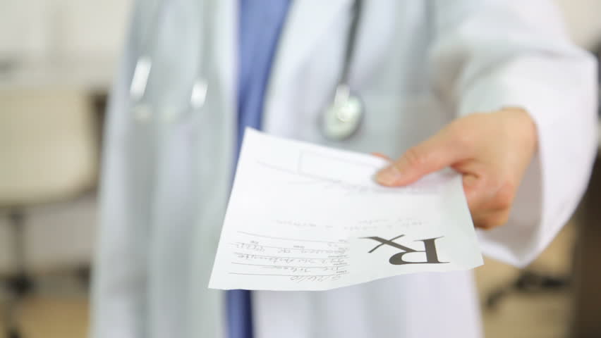 Doctor giving a prescription, close up