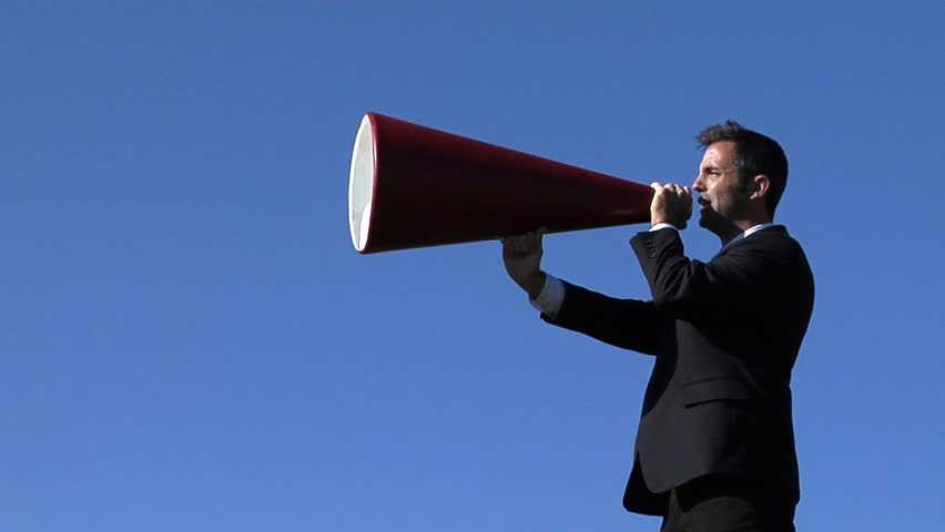 Businessman shouting through a megaphone
