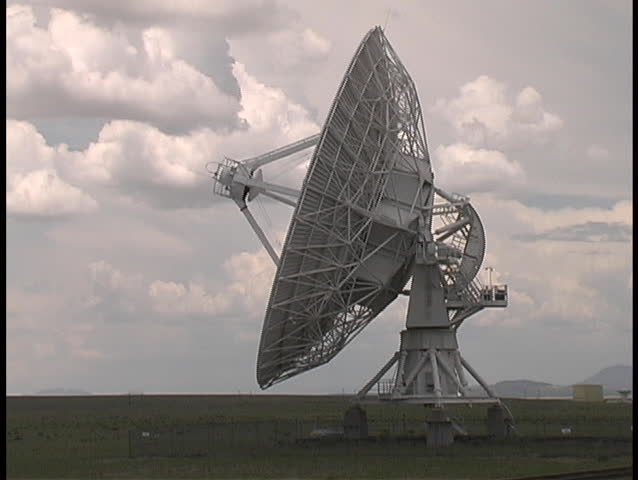 A radio telescope dish rotates towards its target in the sky - from the Very Large Array in western New Mexico
