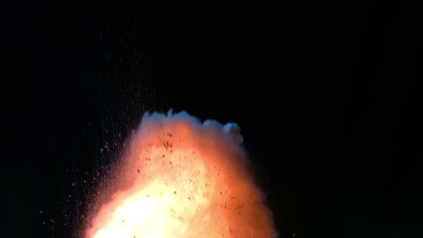 Intense explosion on black background, slow motion