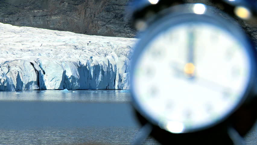 Concept shot of the hands on a clock moving  as time to prevent climate change runs out