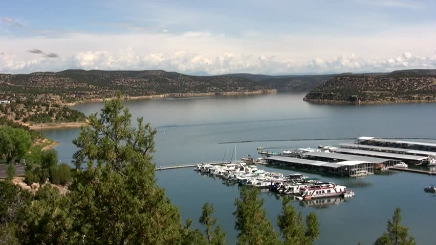 HD slow pan left to right across Navajo Lake and the marina on a bright summer day in northern New Mexico