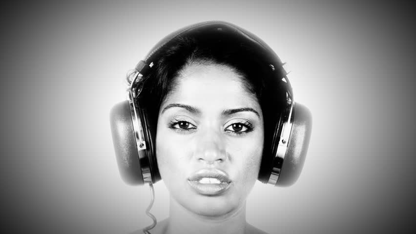 interesting shot of changing retro headphones on a woman's head. very disco