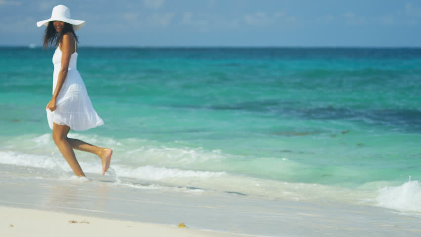 Girl in a white dress walking on the beach images Girl in a white dress walking on the beach images