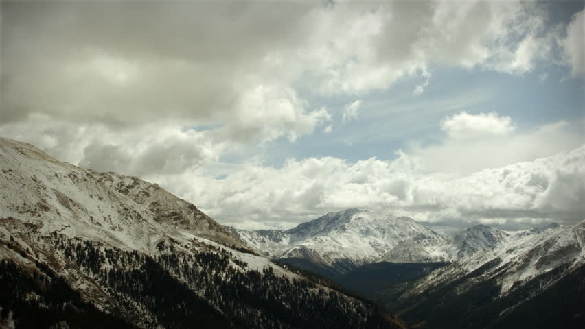 (1120) Early Snow Storm Mountain Pass Colorado, LOOPING! Great for themes of nature, travel, wilderness, seasons, weather, mountains, exploration, outdoor recreation, adventure.