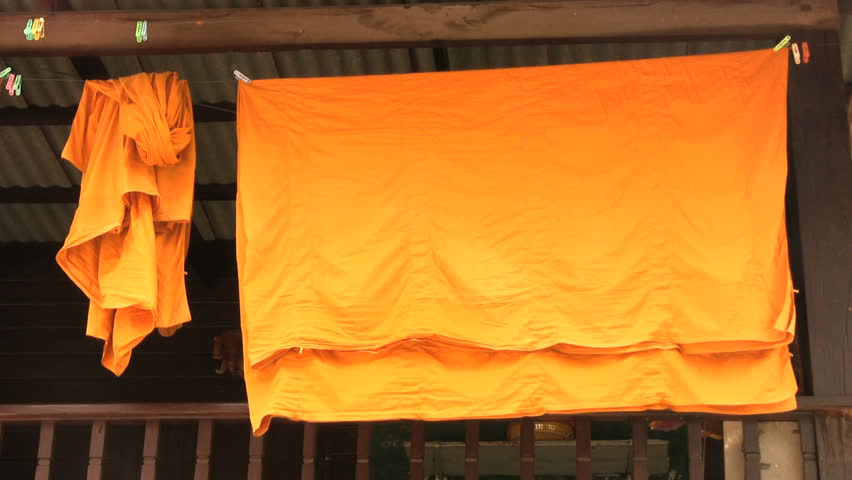 Monks robes sway gently in the breeze in Bangkok, Thailand, as they dry after being washed.