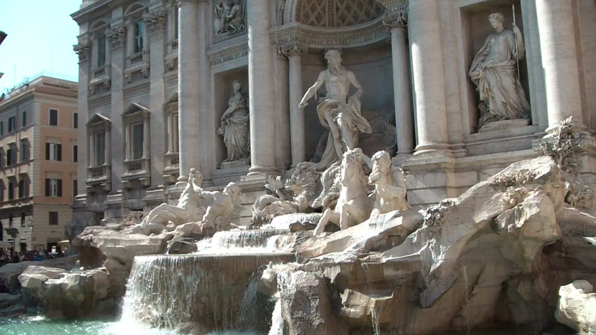 The famous Trevi Fountain (Fontana di Trevi) in Rome, designed by Nicola Salvi in Baroque and Rococo fashion. Wide shot of the fountain and detail of a sculpture of horses.