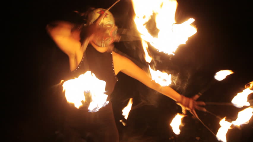 a woman does a fire performance