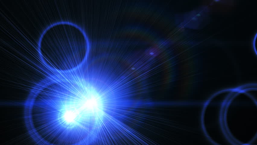 Flashbulbs popping over black background.