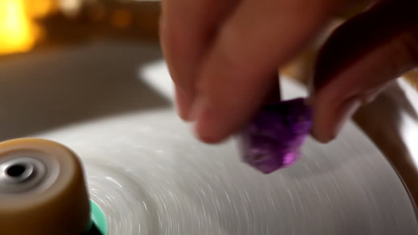 Hand polish gem - macro with water 