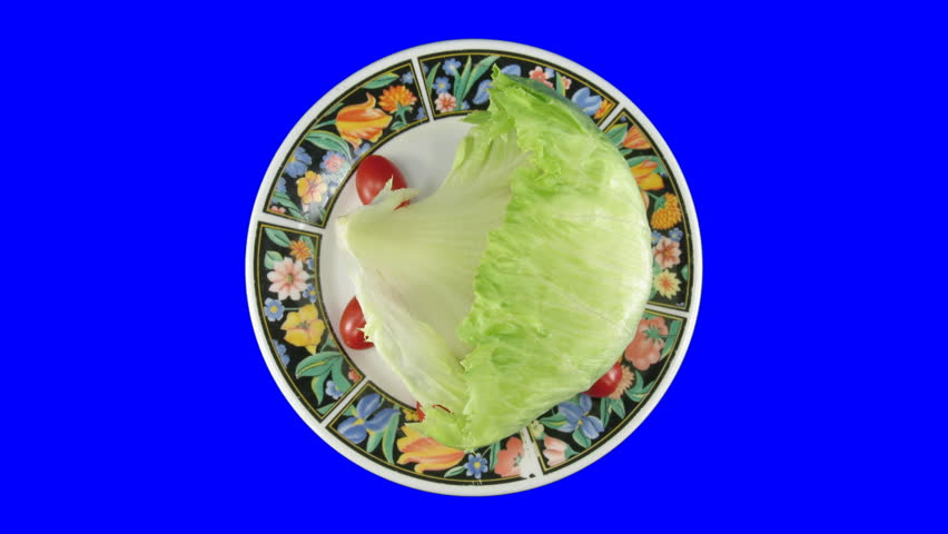 Time-lapse of wilting rotating salad 4ck with blue chroma key 