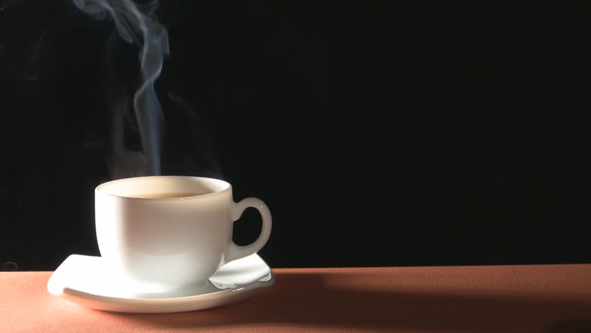  Cup of hot drink with steam over black background 