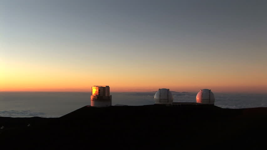 HD: Telescope Observatory at Sunset. An observation station atop Mauna Kea, a dormant volcano on the Big Island of Hawaii, at sunset, featuring the W. M. Keck Observatory and the Subaru Telescope 