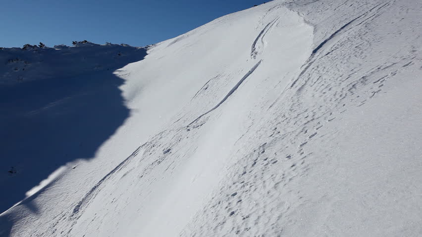 extreme skier on steep hill