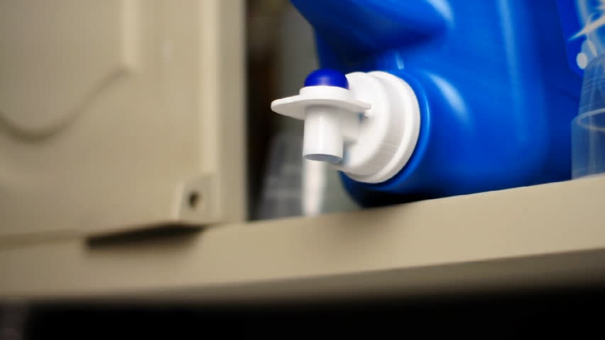 Measuring laundry detergent.  Shallow depth of field.