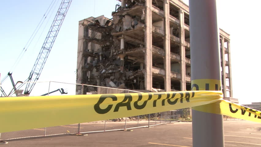Caution tape in front of building