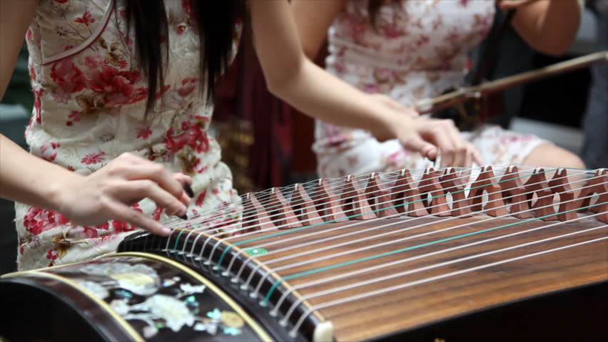 Chinese Traditional Musician Playing Chinese Guzheng Guzheng Also