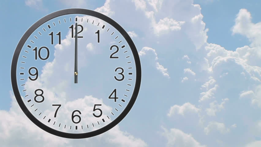 Time lapse of clock with rolling cumulus clouds - twelve hour, loopable. 
